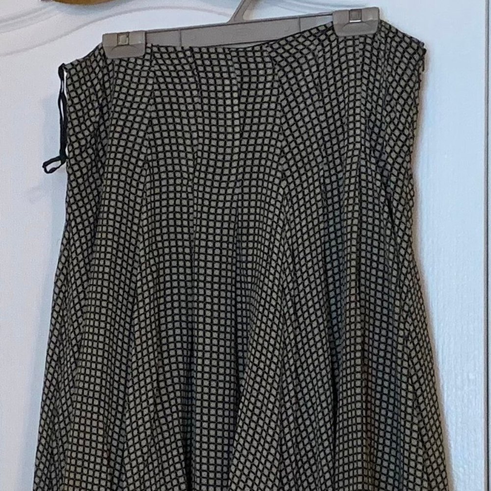 Black and white patterned flowing silk skirt.